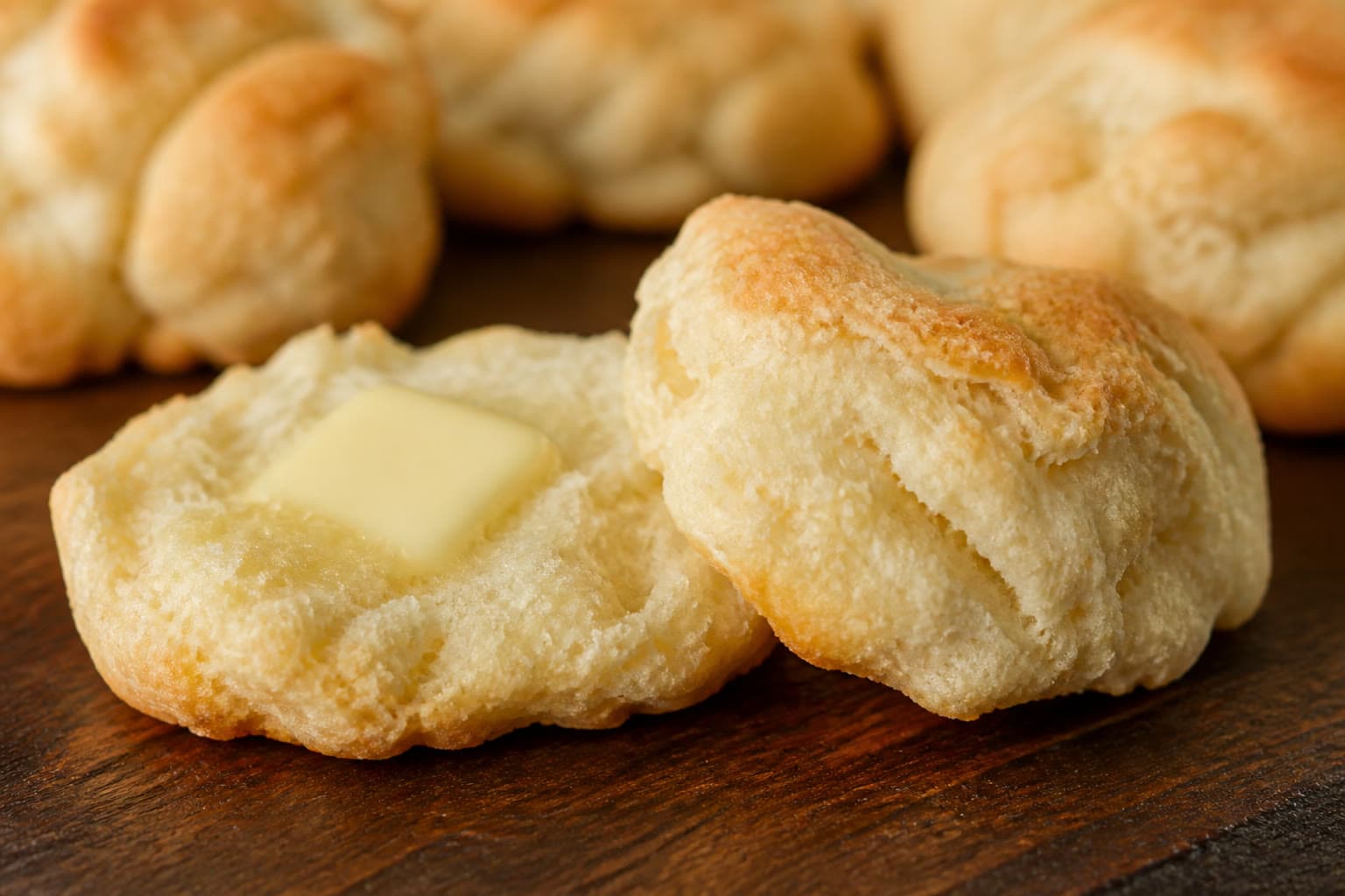 Golden gluten-free sourdough discard biscuits split to show flaky layers
