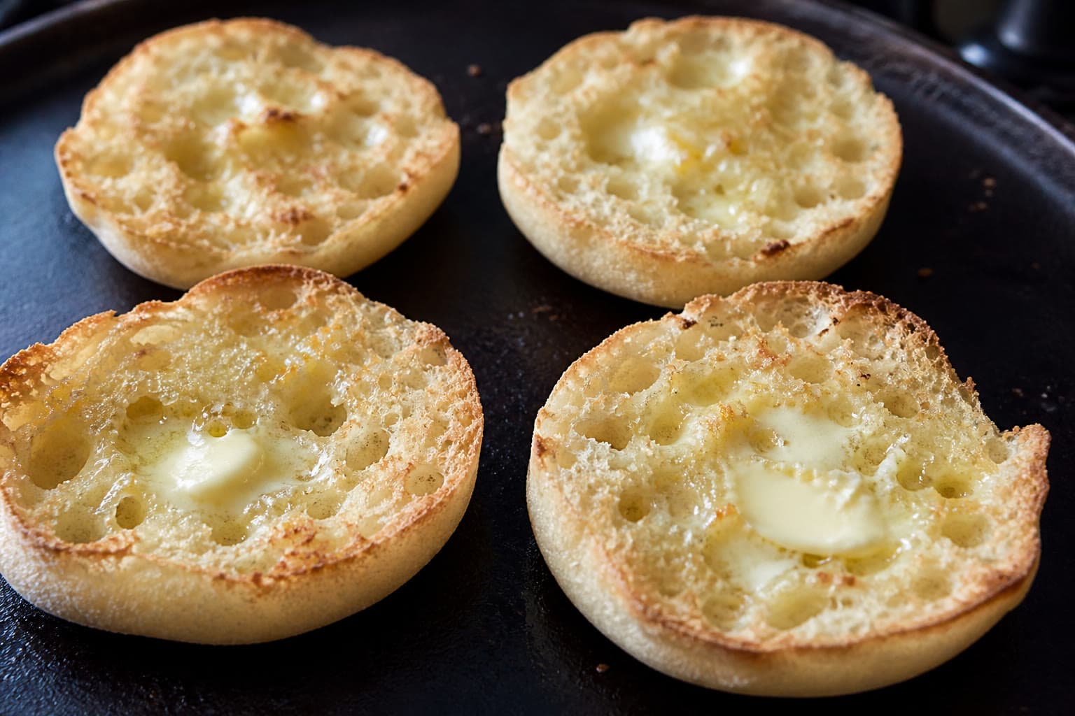 Fork-split gluten-free sourdough English muffins with nooks and crannies