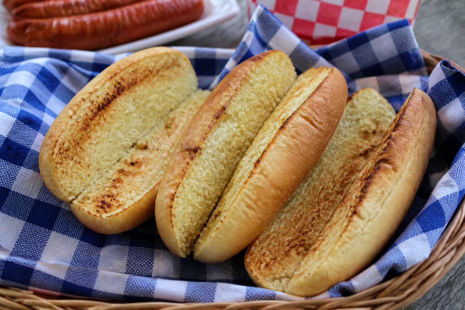 Split toasted gluten-free sourdough hot dog buns